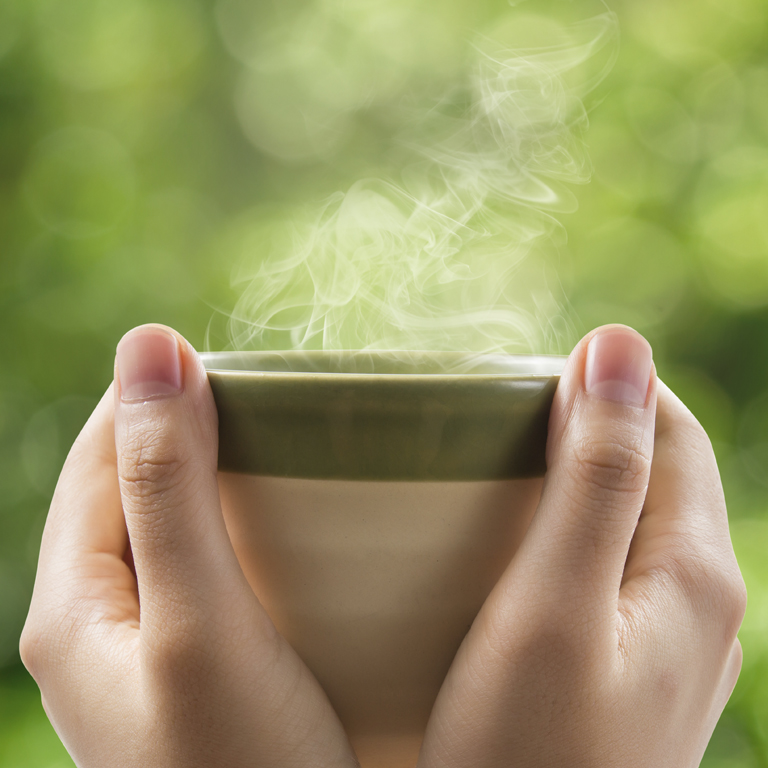 steaming cup of green tea